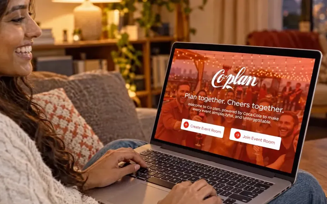 Co-plan's landing page on a laptop, with a Coca-Cola bottle beside it